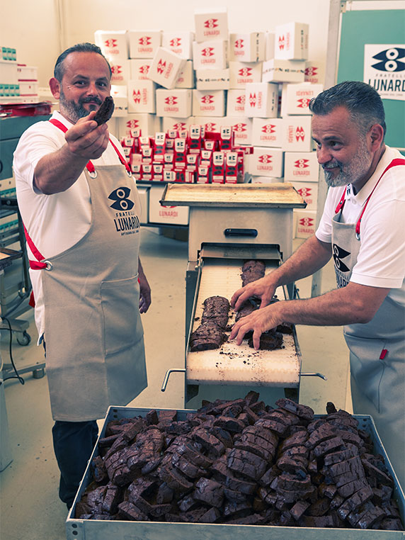 Massimiliano and Riccardo Lunardi with chocolate biscuits